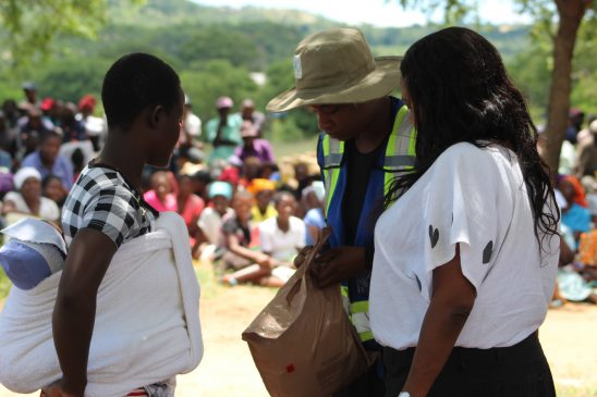 WFP Programme Officer Nutrition Safinaz ElTahir Ahemed shares a moment with one of the beneficiaries in Rushinga (Pic By Michael Gwarisa)