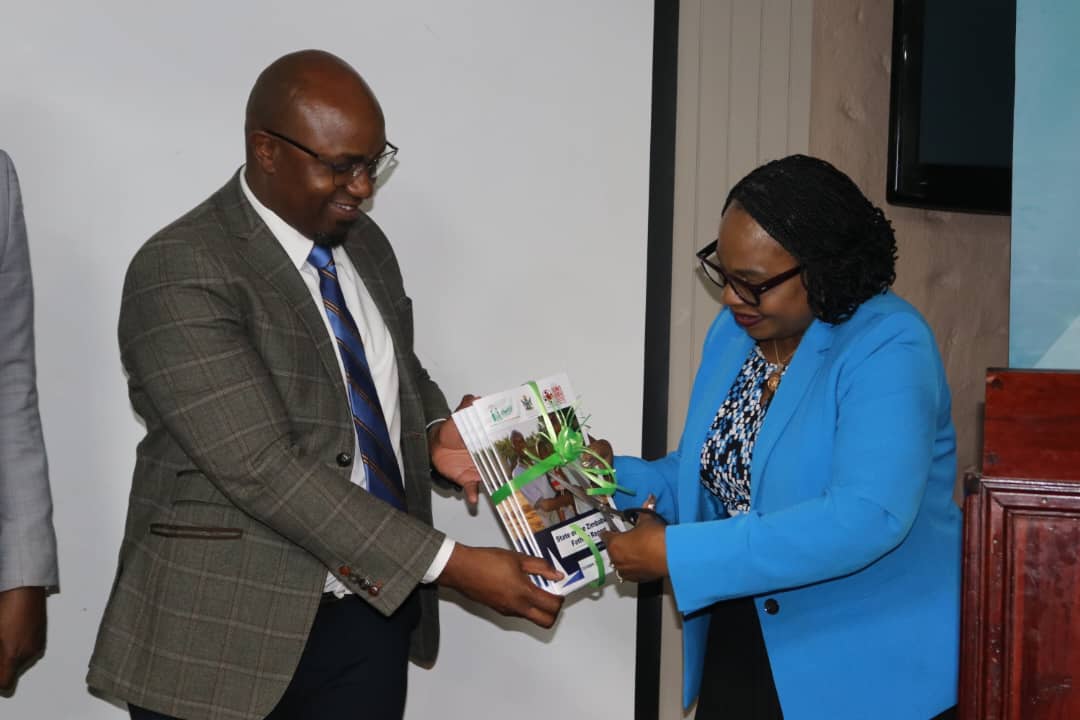 Musa Hove Safaids hands over SOF Report to Minister Mutsvangwa