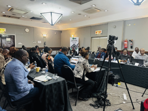Journalists follow proceedings at the media breakfast meeting